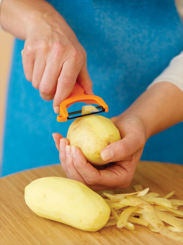 Kuhn Rikon Purple Original Swiss Peeler handle with ergonomic grip for comfortable peeling