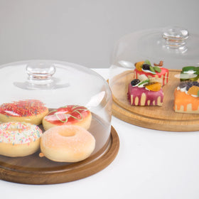 KVMORZE acacia wood base supports a sturdy display for snacks.
