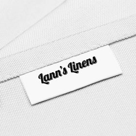 Close-up shows stain-resistant polyester of Lann's Linens 90-inch round tablecloth.