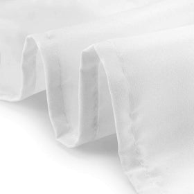 Wrinkle-free drape of Lann's Linens 90-inch round tablecloth on a banquet table.