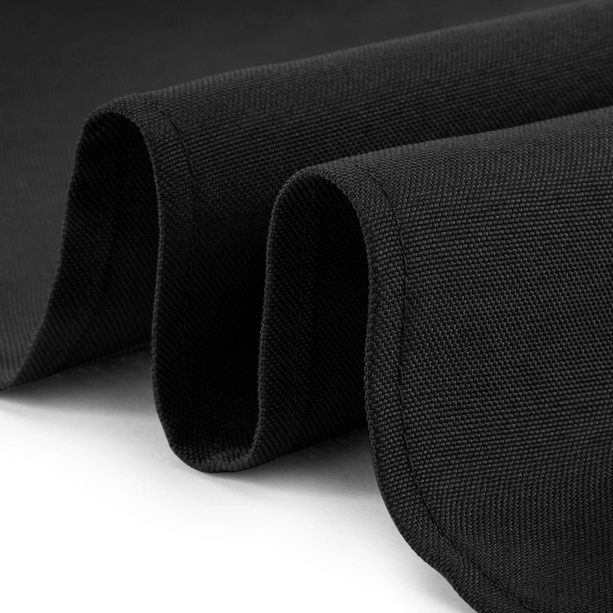 Wedding banquet scene with black Lann's Linens tablecloth creating elegant ambience