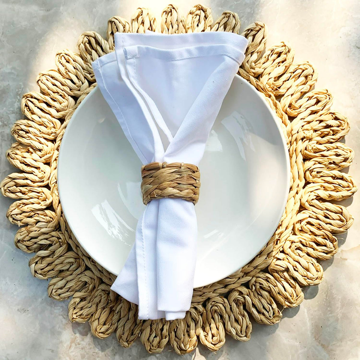Laquedecraft water hyacinth napkin ring on dining table showcases eco-friendly décor.