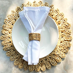 Laquedecraft water hyacinth napkin ring on dining table showcases eco-friendly décor.