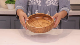 LAVAUX DESIGNS acacia bowl with oil-free coating keeps a rustic shine.