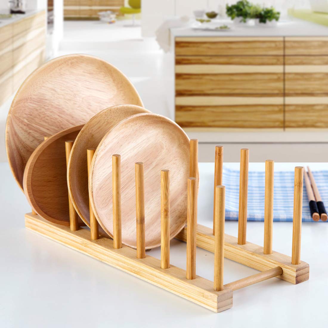 Lawei lids and cutting boards drying neatly on bamboo rack.