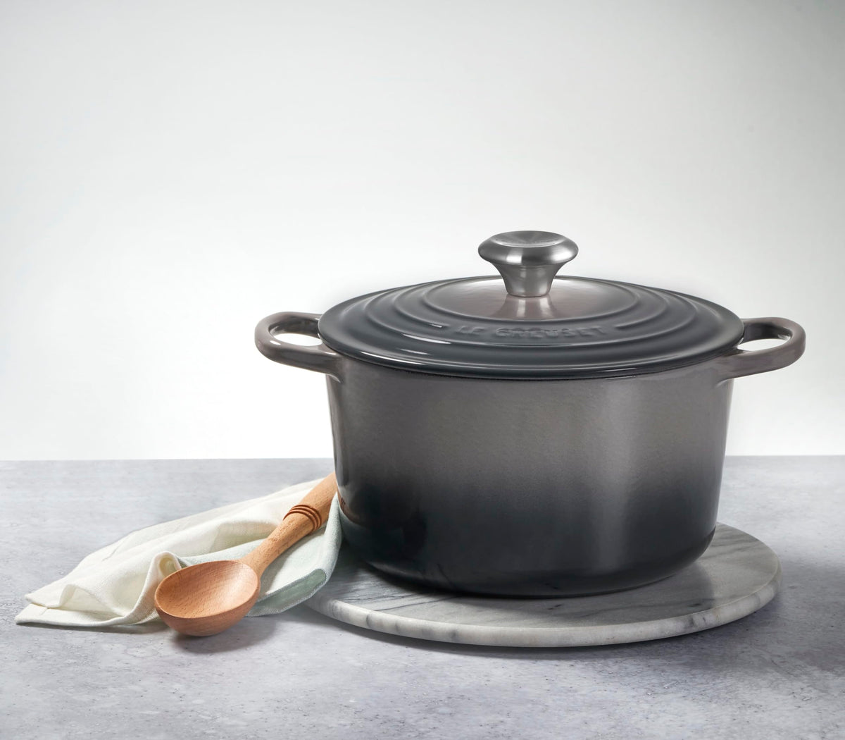 Le Creuset Deep Round Oven Sea Salt on stove demonstrates versatile cooking