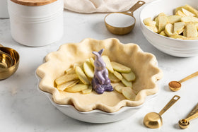 Le Creuset gold finish measuring cups in 1/3 cup for accurate dry measurements.