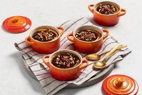 Le Creuset mini round cocotte 8 oz white, oven and microwave safe for versatile use.