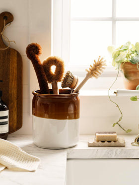 LE TAUCI coffee pods storage idea kept neatly in the large crock