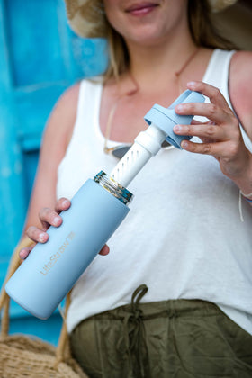LifeStraw Go Series insulated bottle outside view, keeps drinks cool on long trips.