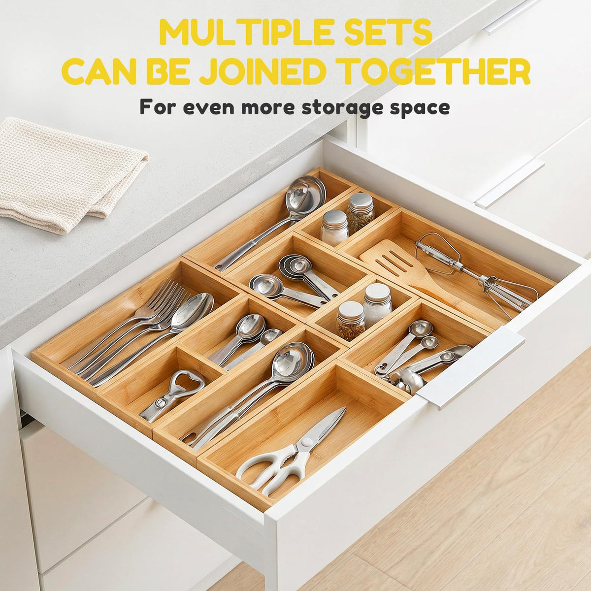 lilLittle bamboo drawer organizer keeps utensils and gadgets neatly sorted in drawers.