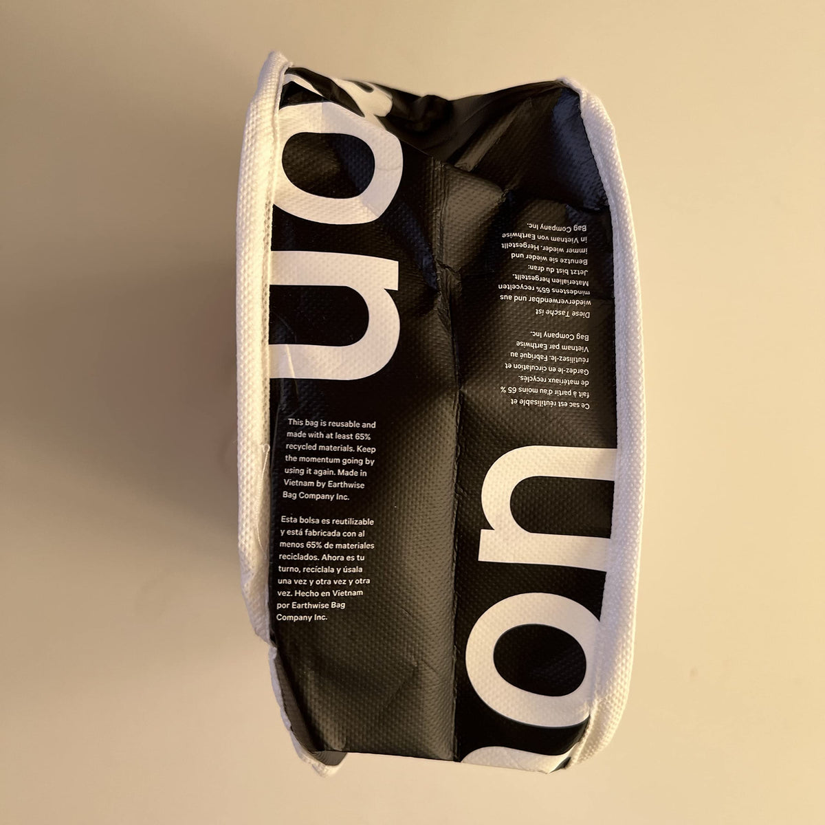 Lululemon new white gym tote bag side view, durable and versatile for gym and shopping.