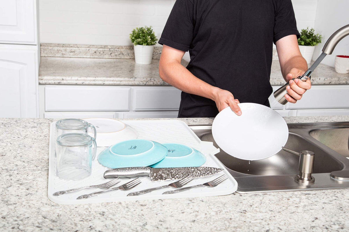 Luxet dish drying mat helps keep countertops organized and dry after washing.