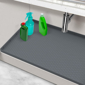 MECHEER under-sink mat 28x22 laid flat to shield cabinet from leaks