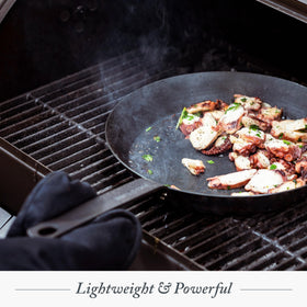 Camping-ready Merten & Storck pan used on a campfire setup
