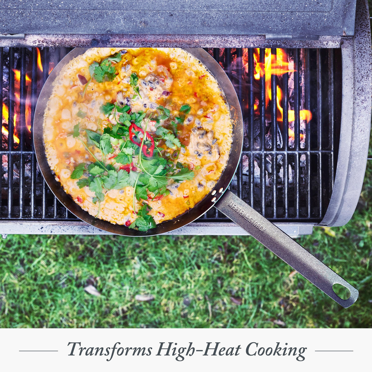 Merten & Storck induction-safe carbon steel pan on a modern stove