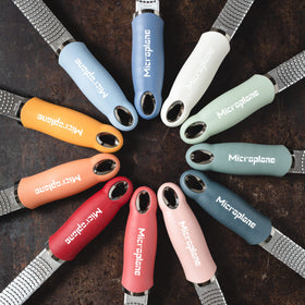 Microplane Premium Zester Grater magnetic strip storage for tidy kitchen.