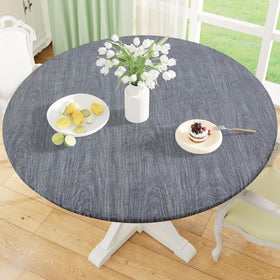 Misaya round fitted tablecloth showing elastic edge for secure fit during windy outdoor dining.