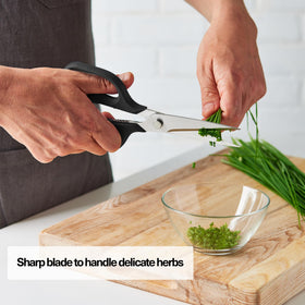 Misen Heavy Duty Kitchen Shears cutting thick meat with ease in busy kitchen.