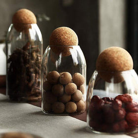MOLFUJ clear glass container with wood cork lid showcases contents neatly.