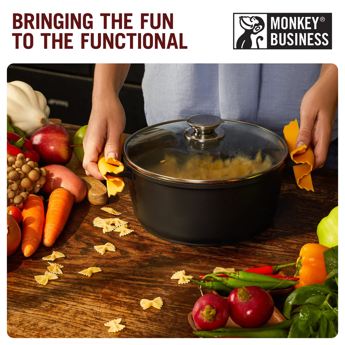 Monkey Business mini silicone pinch mitts in use, easy daily transfers of hot pans.