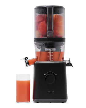 Nama J2 Juicer with self-feeding hopper enabling hands-free loading for multitasking.