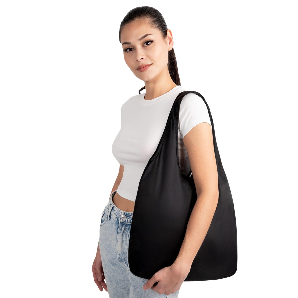 Nanobag tote in-use with groceries, compact and convenient.