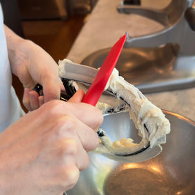 New Metro Design Spatula ONE beater-cleaning aid helps reach tight corners.