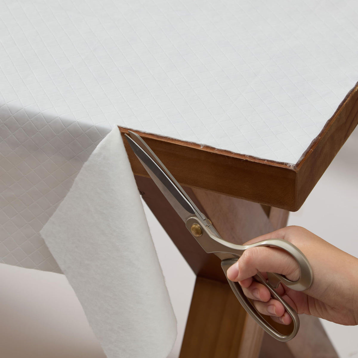 Newbridge Quilted Table Pad Protector demonstrates waterproof surface protection for 52x102 table.