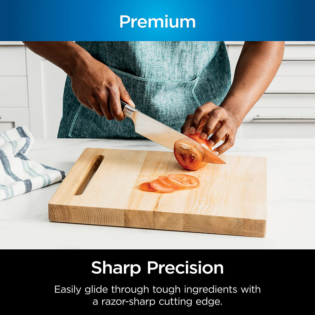 Ninja NeverDull 5-inch Santoku knife showing balanced grip.