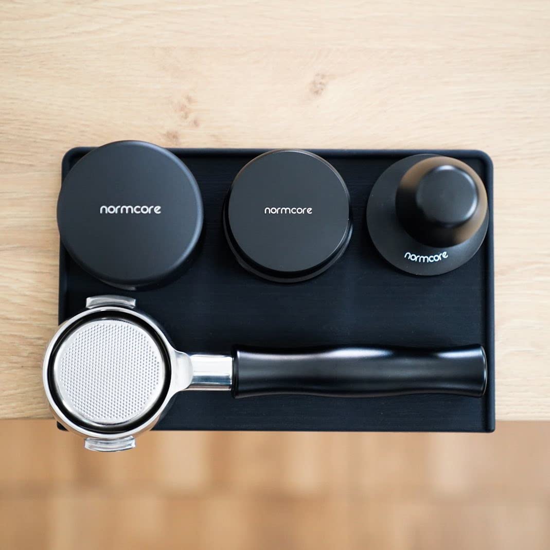 Normcore tamping mat with portafilter secure grip prevents slips during tamping.