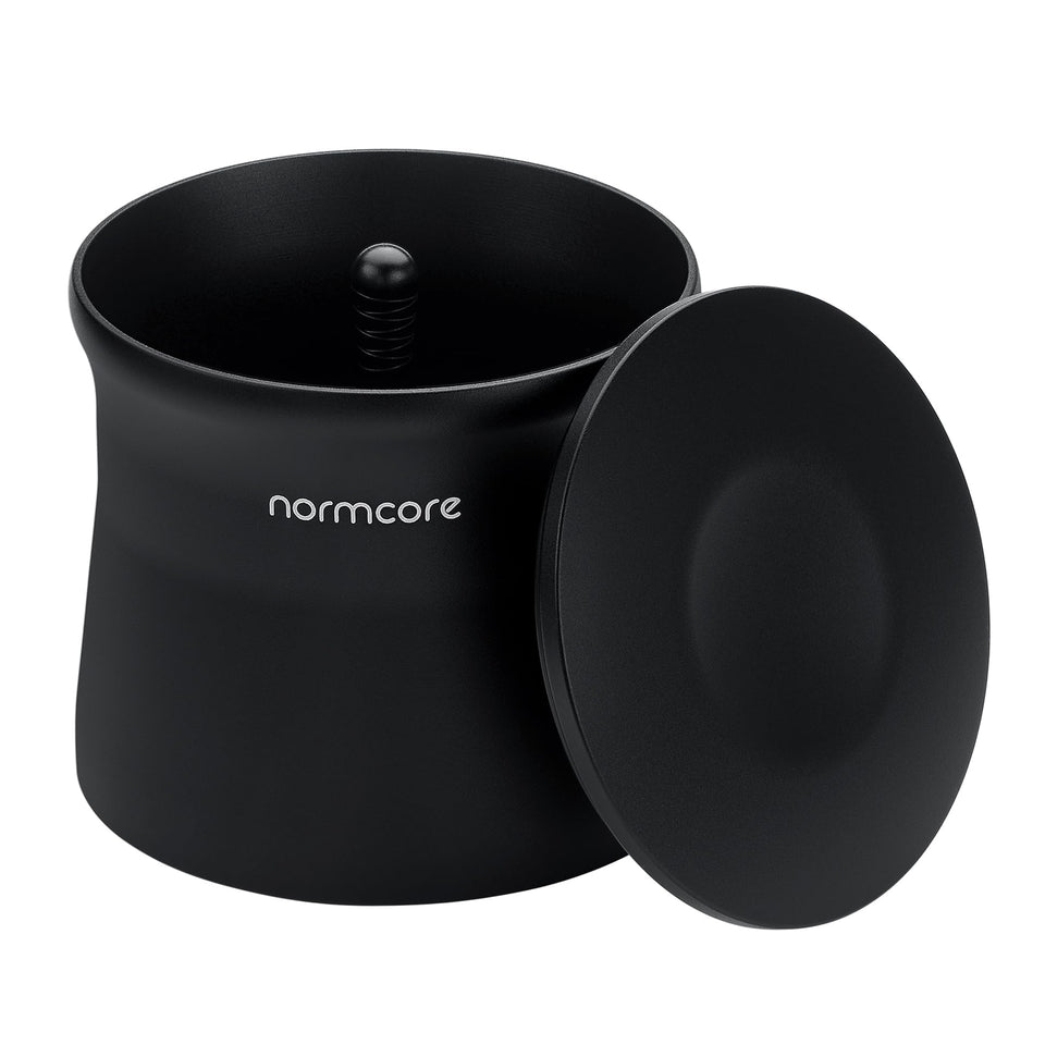 Normcore magnetic dosing cup showing 58mm portafilter fit for precise dosing.
