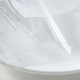 Obstal clear tablecloth demonstrates stain-proof surface for easy cleanup.