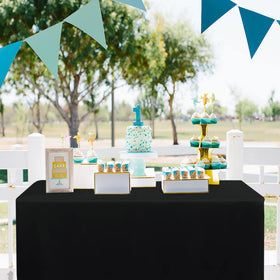 Obstal outdoor/indoor table cover protecting surfaces during events.