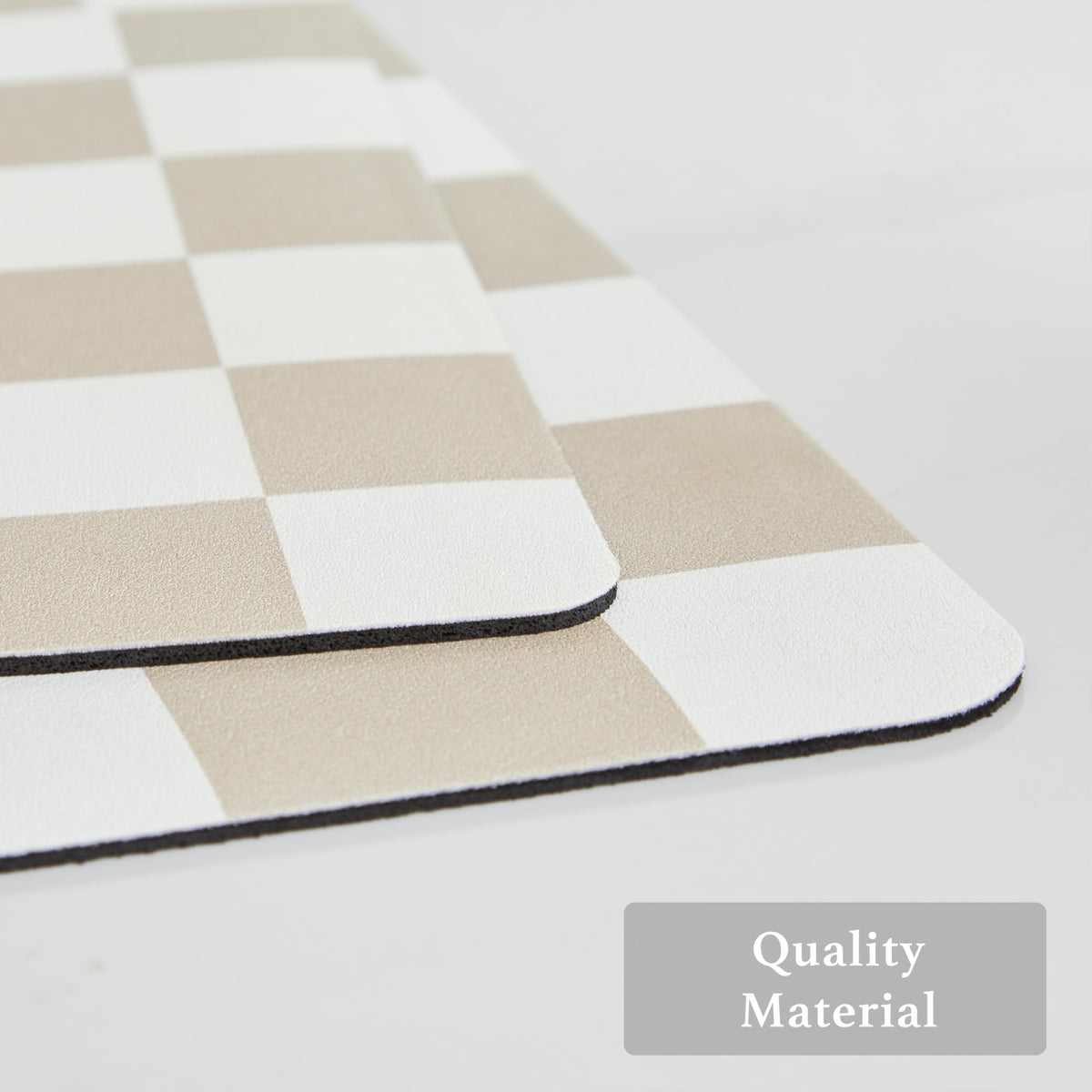 Ohocut checkered drying mat on kitchen counter helps keep surfaces dry after use.