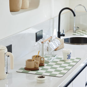 Ohocut checkered drying mat in sage on kitchen counter absorbing moisture quickly