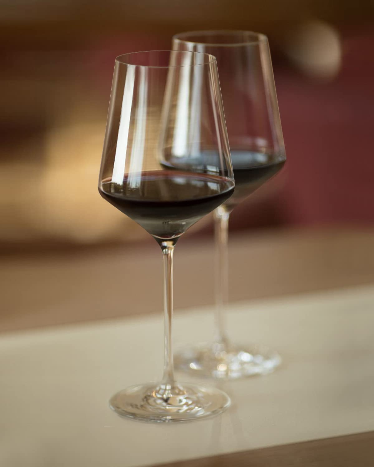 OJA tulip-shaped wine glasses promote aroma release and balanced aeration.