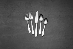 Oneida Mooncrest dinner fork in a coordinated place setting.