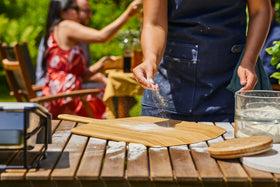 Ooni 12-inch bamboo pizza peel compact storage in a kitchen