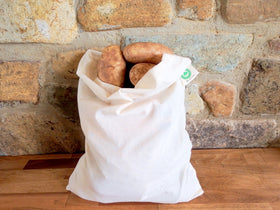Organic Cotton Mart drawstring potato bag shown for hanging pantry organization.