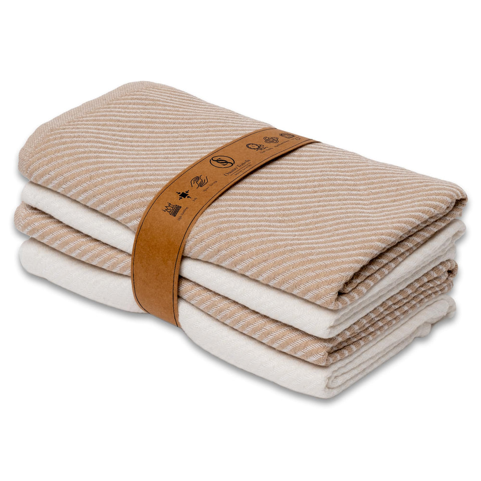 Ossano Kitchen Towels four-pack in beige and ecru, folded for display and quick drying.