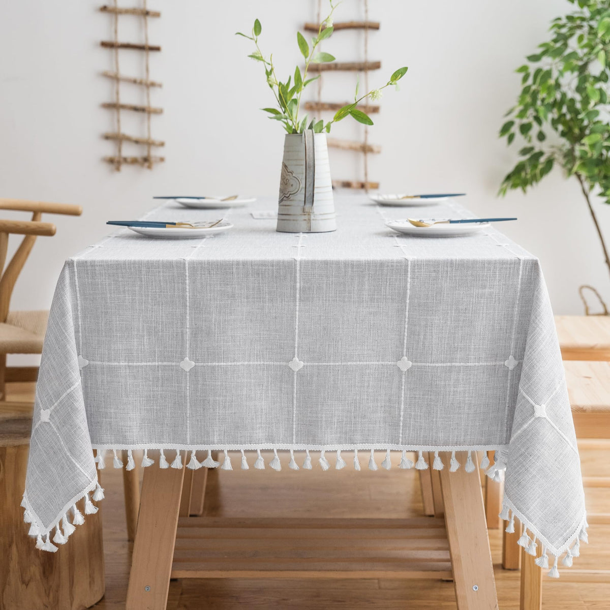 Oubonun grey rectangle tablecloth draped elegantly on a 4–6 seat dining table