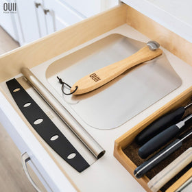 OUII pizza peel extended to 25 inches to protect hands during deep ovens.