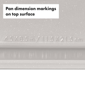 Nonstick ceramic coating aids easy release and quick cleanup on storm blue loaf pan.