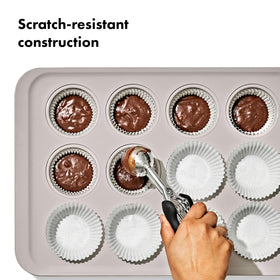 OXO Good Grips muffin pan, close-up, square-rolled edge adds durability for steady baking.