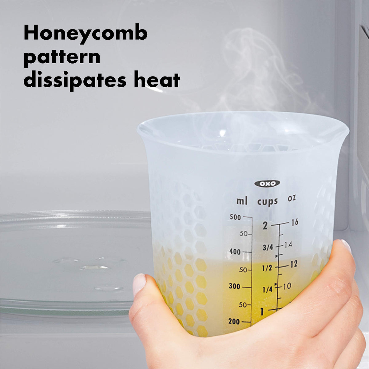 OXO Good Grips silicone measuring cup with flat base stays stable on countertops.