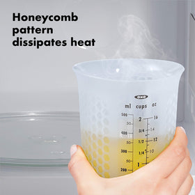OXO Good Grips silicone measuring cup with flat base stays stable on countertops.