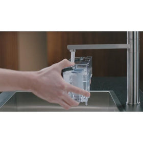 Philips AquaClean filtered water poured for a better espresso taste.