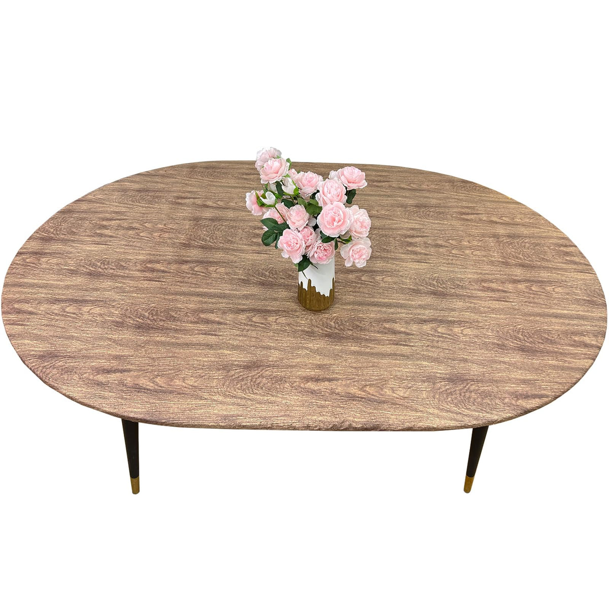Pioggia oval vinyl fitted tablecloth with flannel backing on table, snugly protecting surface.