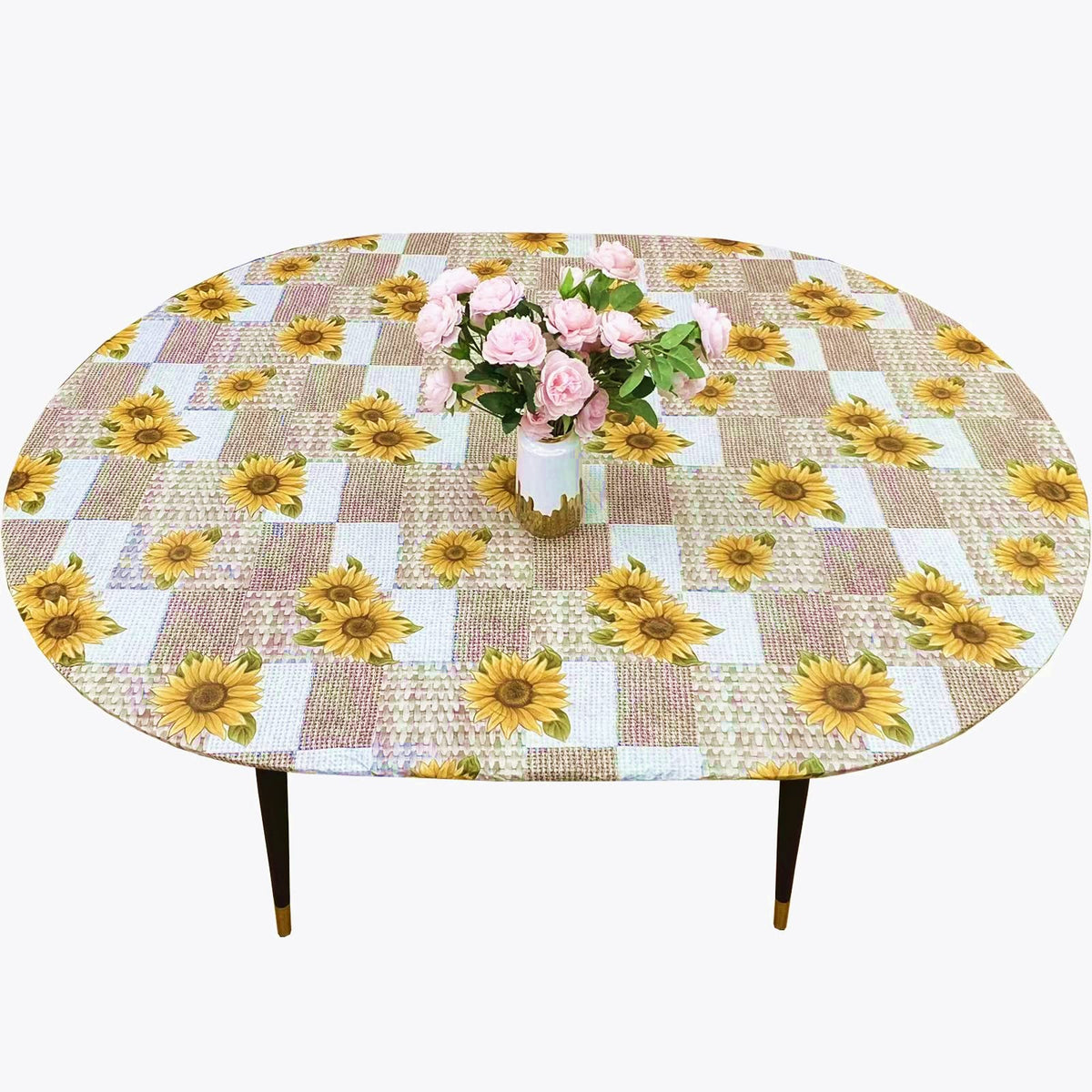 Pioggia oval vinyl fitted tablecloth with flannel backing protects surfaces during daily meals